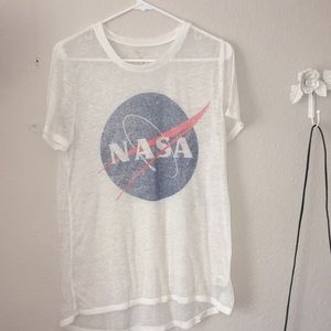 White NASA t-shirt.